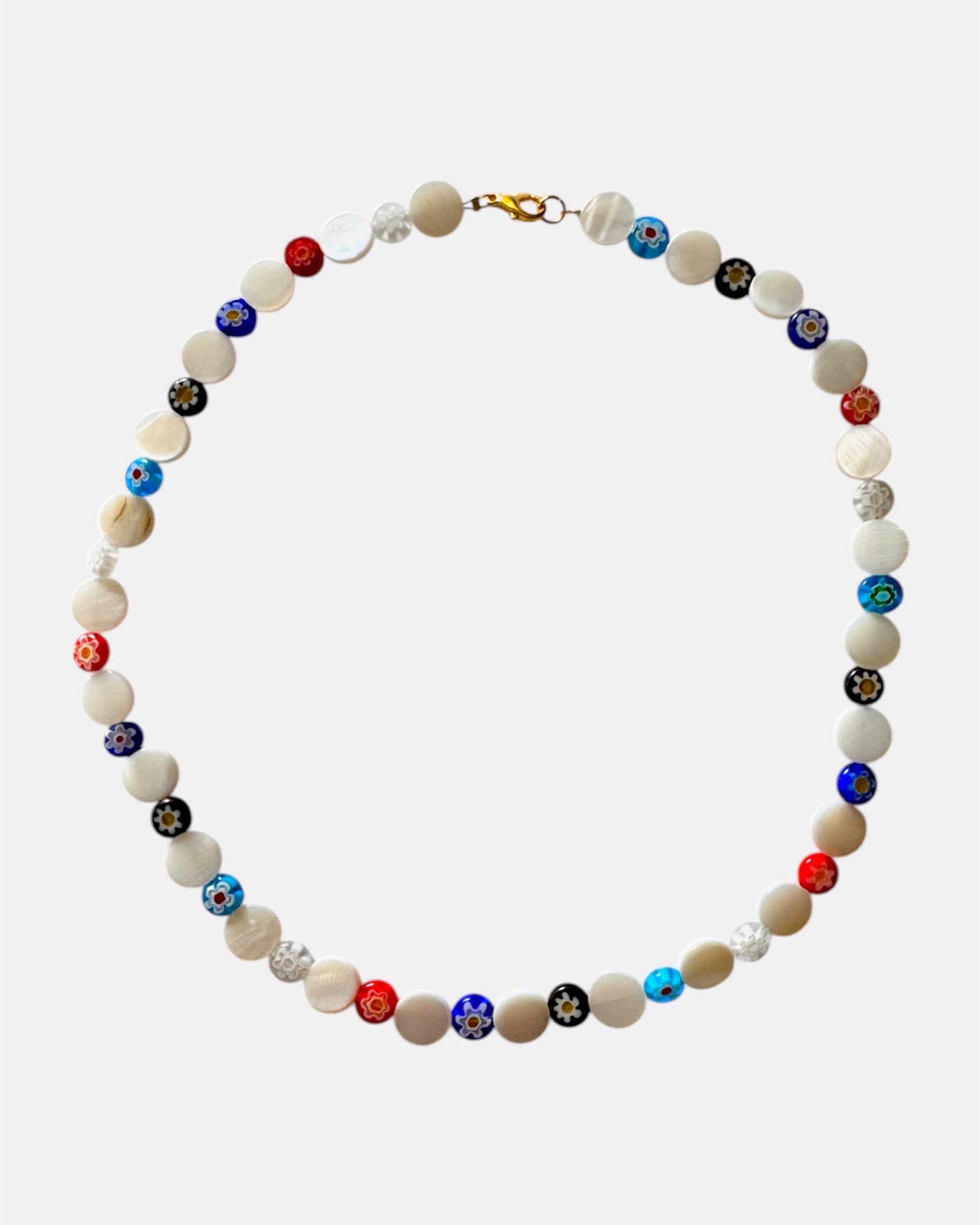 Necklace with multicolored beads on a white background