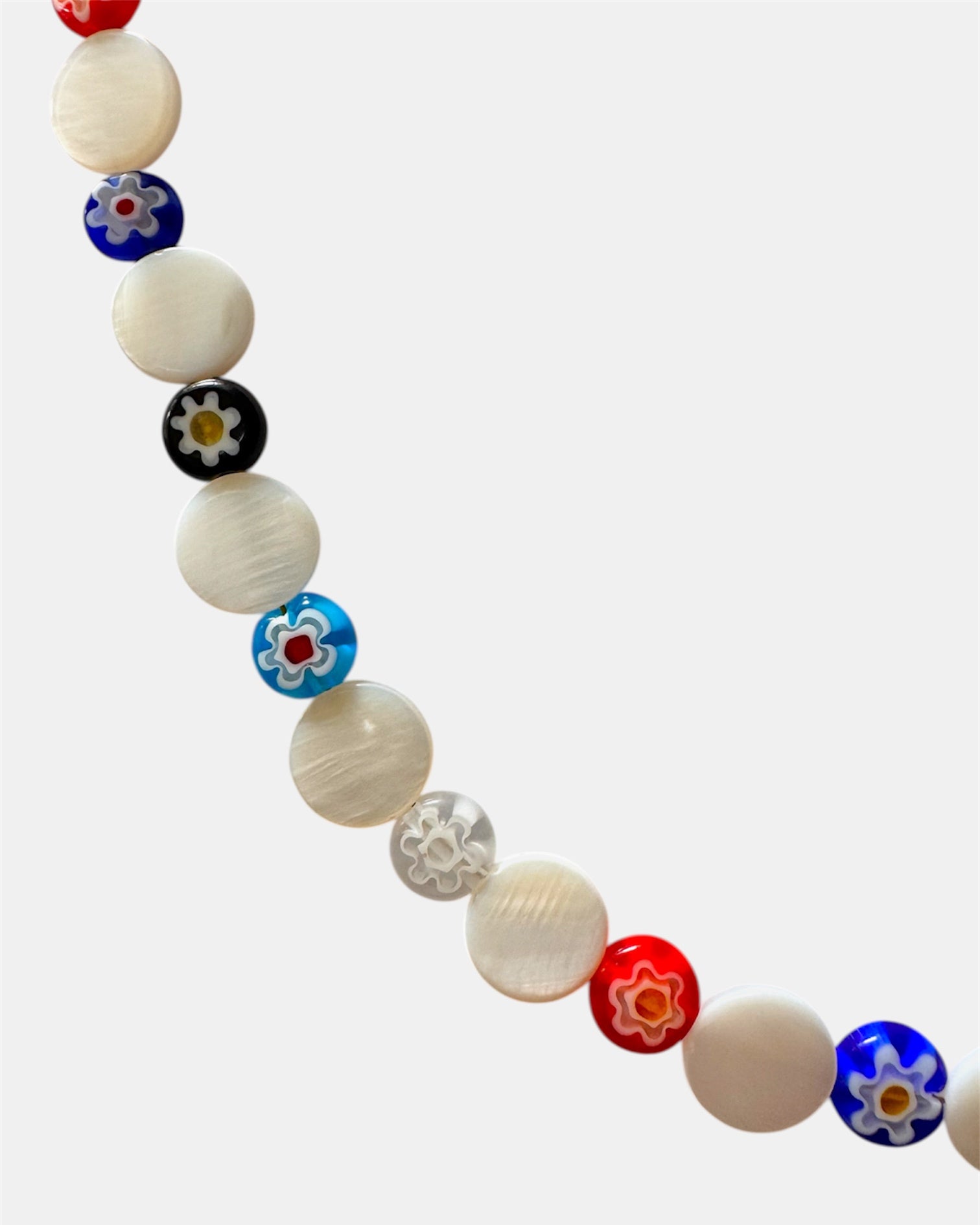 Necklace with colorful beads on a white background