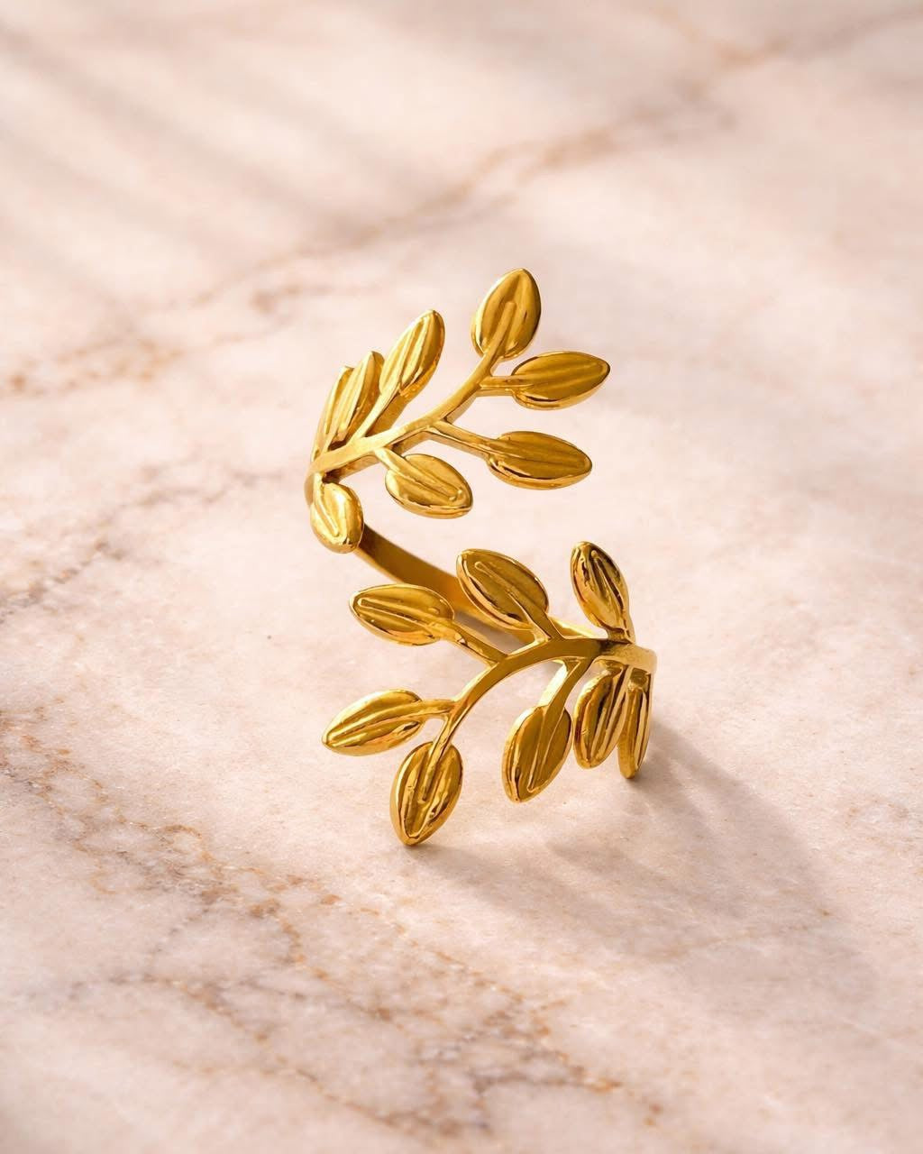 Gold ring with olive leaf design elegant nature-inspired jewelry design