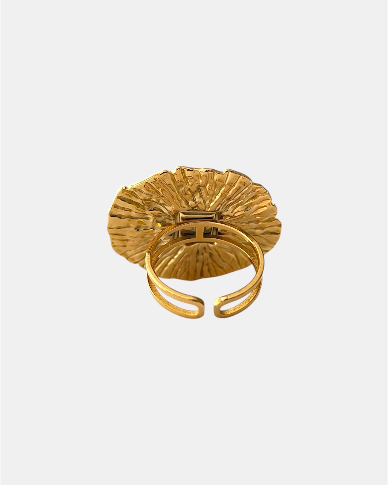 Gold open ring with light blue stone elegant jewelry design