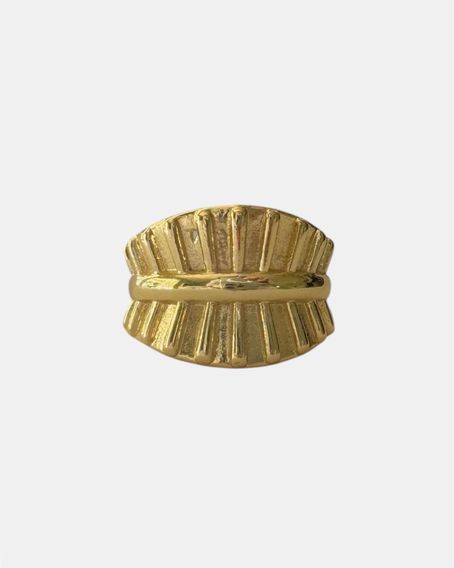 Gold ring with textured surface, elegant modern jewelry piece