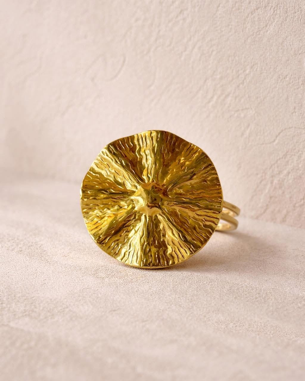 Gold ring with textured surface design