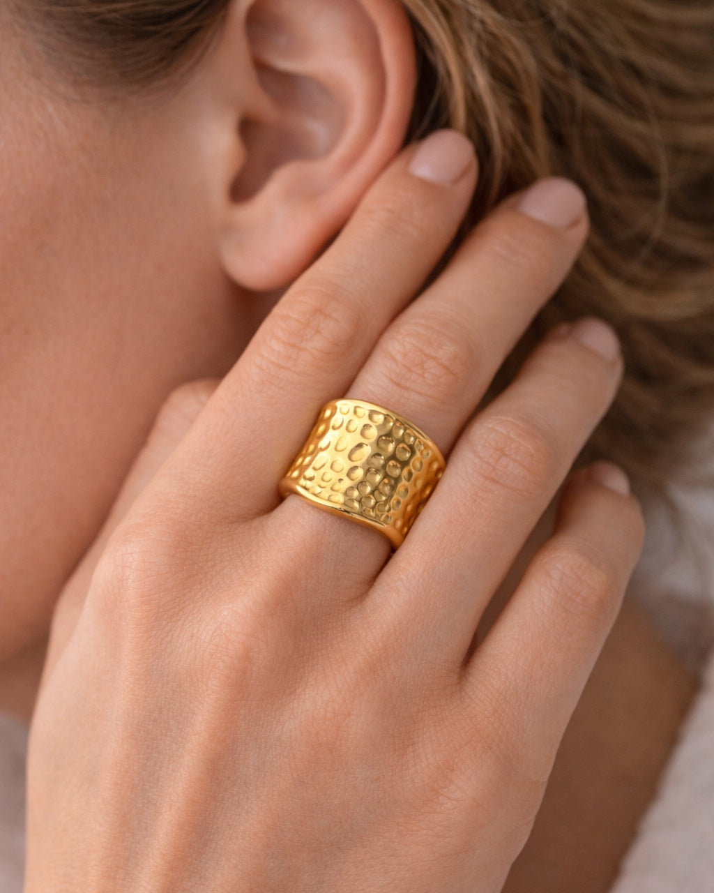 Hammered gold ring with textured finish
