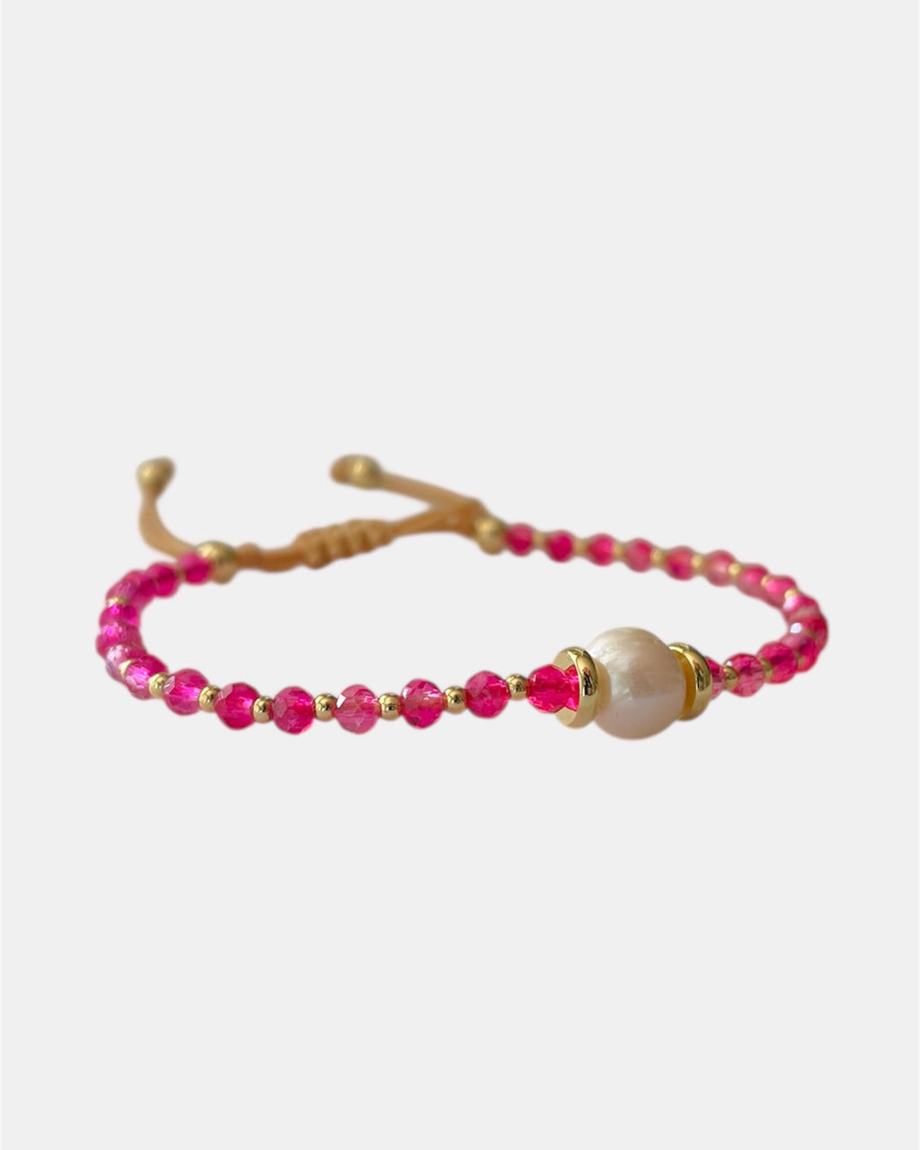 Handmade bracelet with pearl and fuchsia beads, elegant jewelry design combining classic pearl elegance with vibrant modern colors