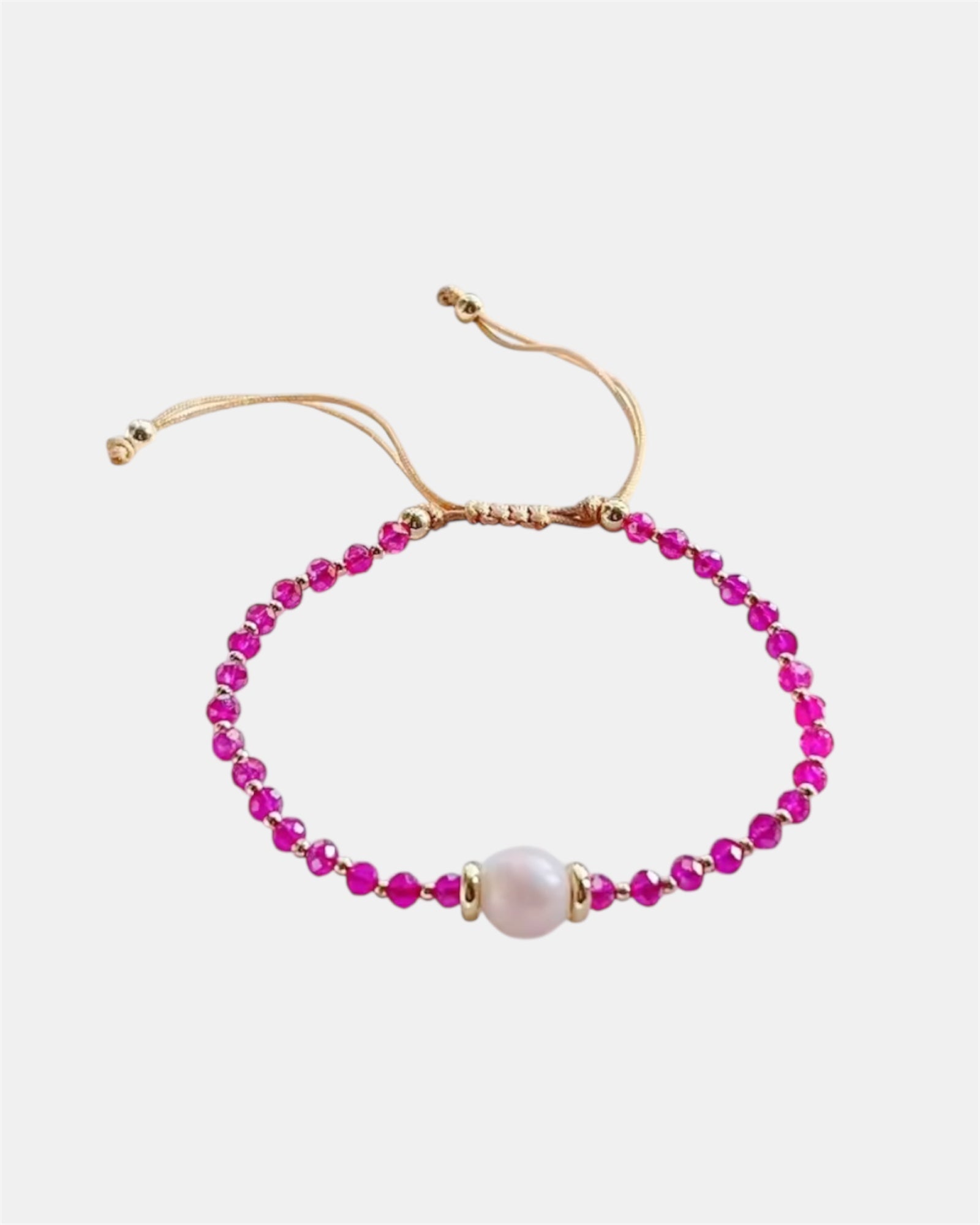 Handmade bracelet with pearl and fuchsia beads, elegant jewelry design combining classic pearl elegance with vibrant modern colors