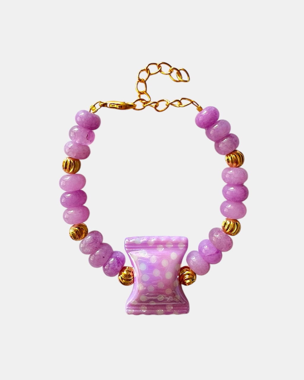 Lilac beaded bracelet featuring a ceramic candy charm for a playful, colorful look