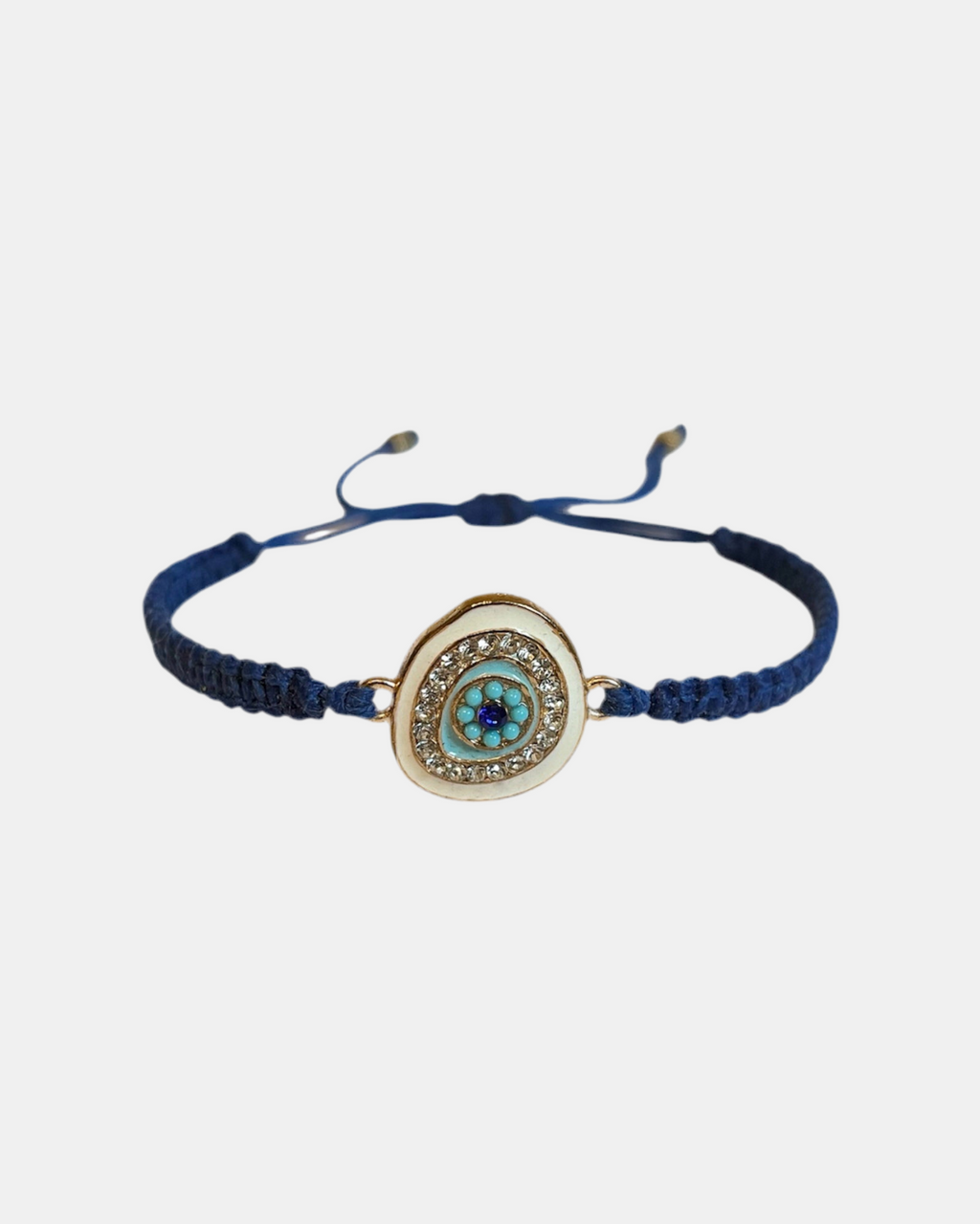 Μακραμέ βραχιόλι σε μπλε απόχρωση με λευκό μάτι ως διακοσμητικό στοιχείο