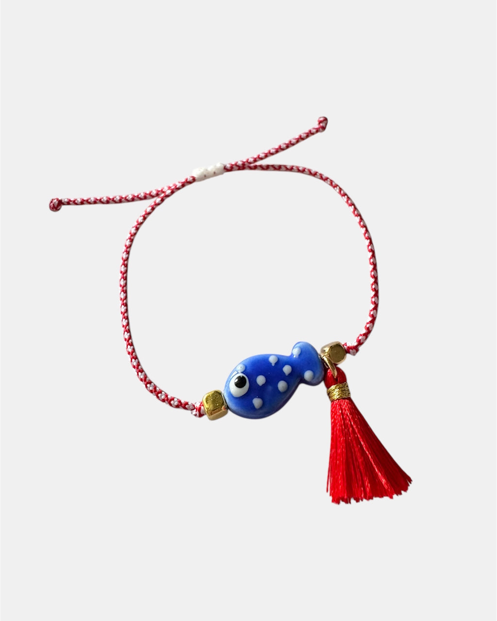 Χειροποίητο μαρτάκι με μπλε γυάλινο ψαράκι και κόκκινη φούντα σε κόκκινο-λευκό κορδόνι