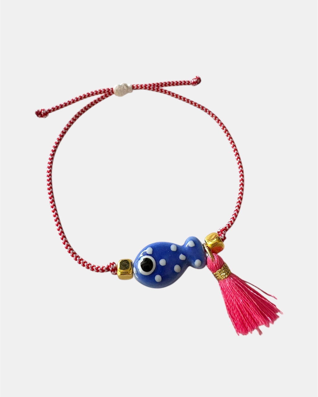 Χειροποίητο μαρτάκι με μπλε γυάλινο μάτι, κόκκινη φούντα και κόκκινο-λευκό κορδόνι