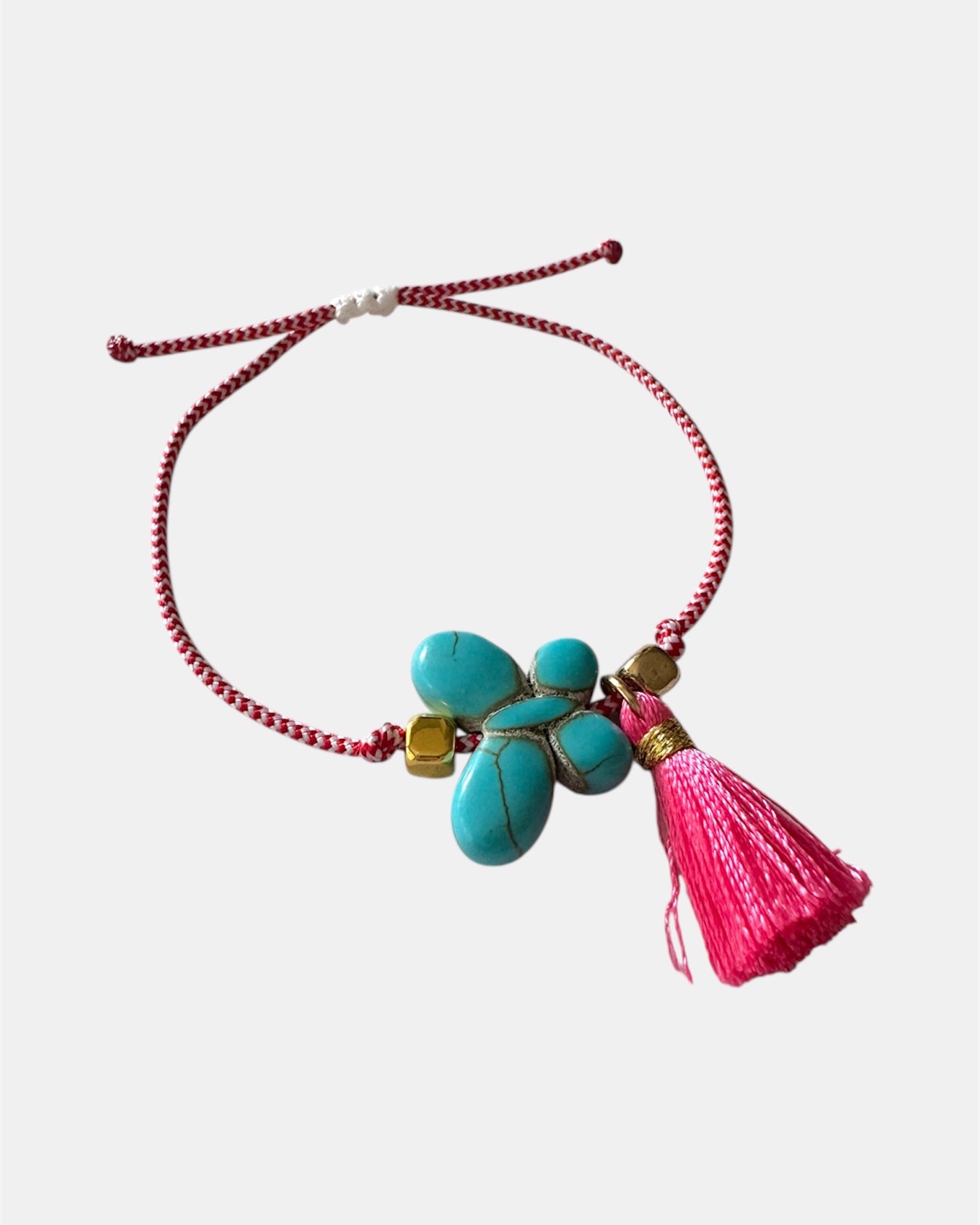 Χειροποίητο μαρτάκι με τιρκουάζ λουλούδι και κόκκινη φούντα σε κόκκινο-λευκό κορδόνι