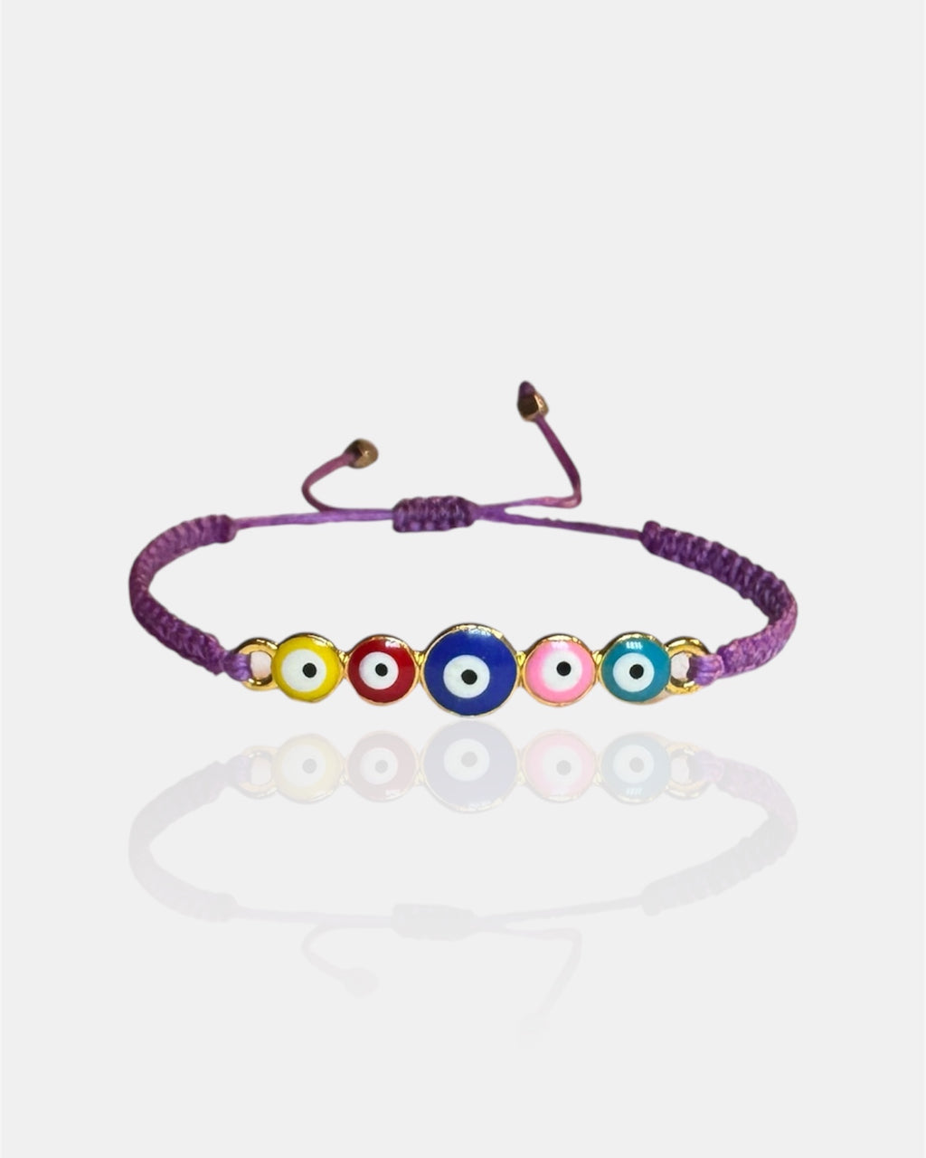 Bracelet with colorful evil eye beads on a white background