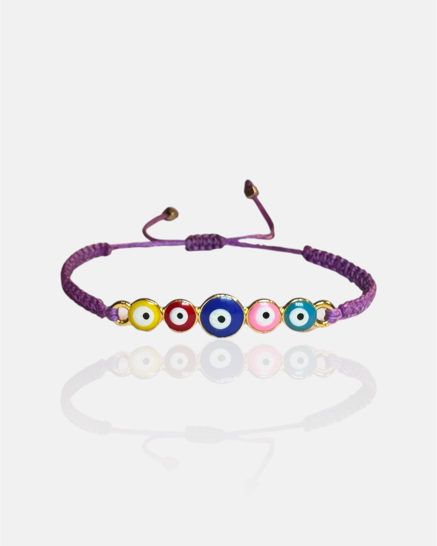 Bracelet with colorful evil eye beads on a white background