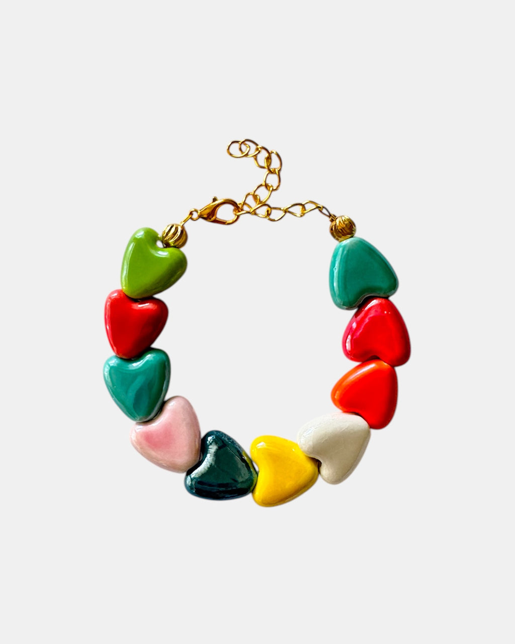 Multicolored bracelet adorned with ceramic heart charms for a fun and vibrant style