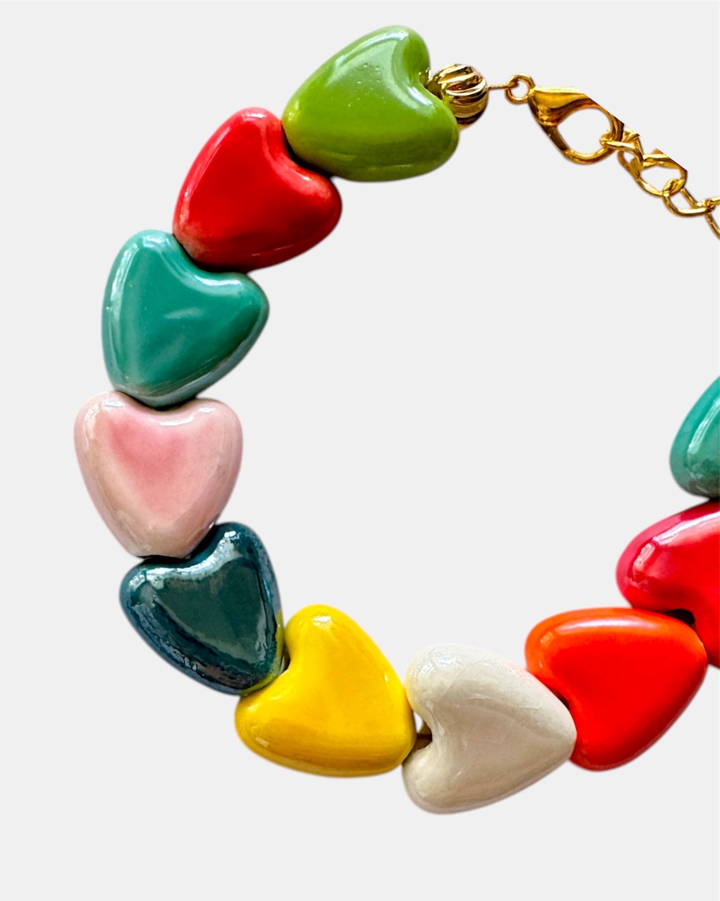 Multicolored bracelet adorned with ceramic heart charms for a fun and vibrant style