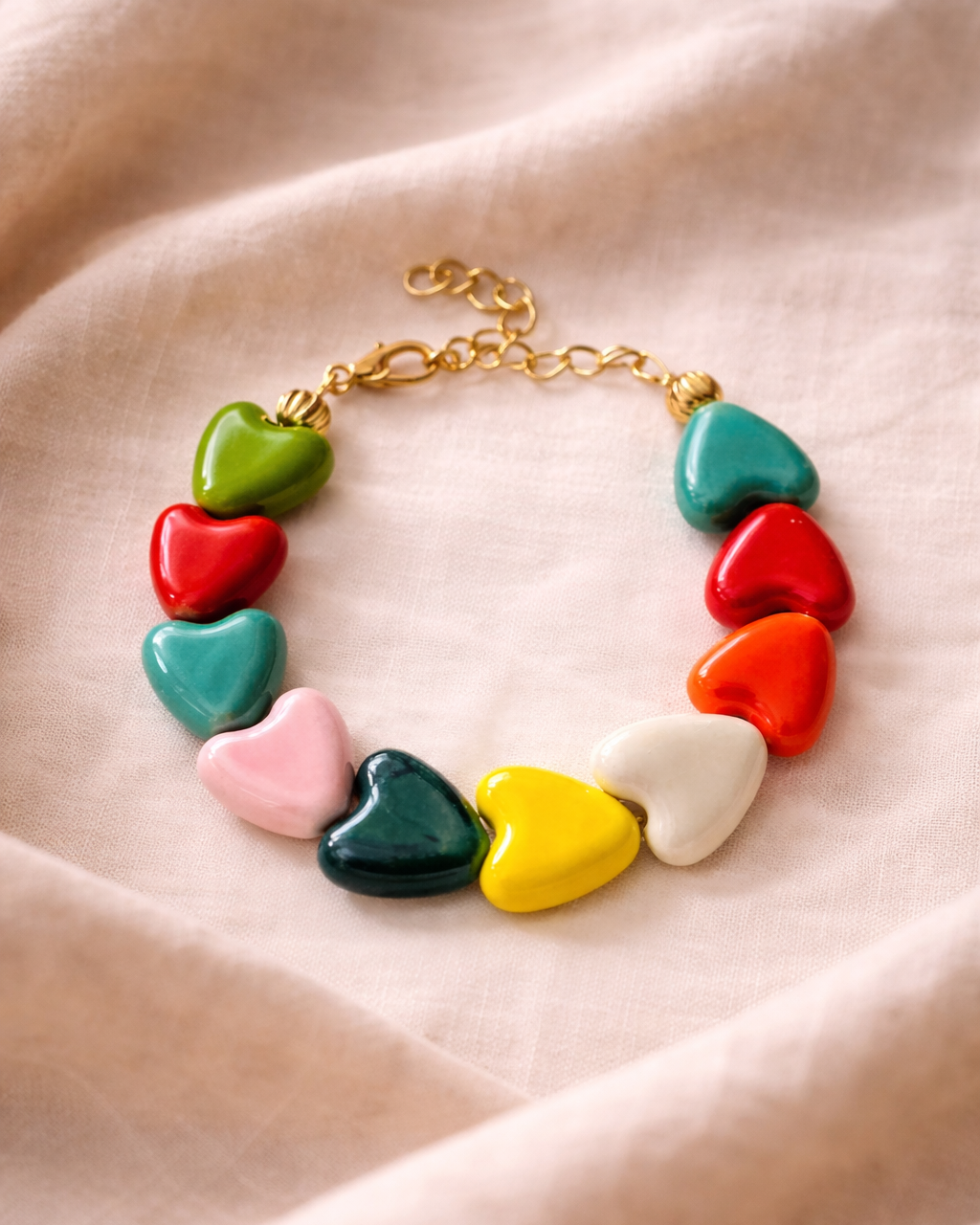 Multicolored bracelet adorned with ceramic heart charms for a fun and vibrant style