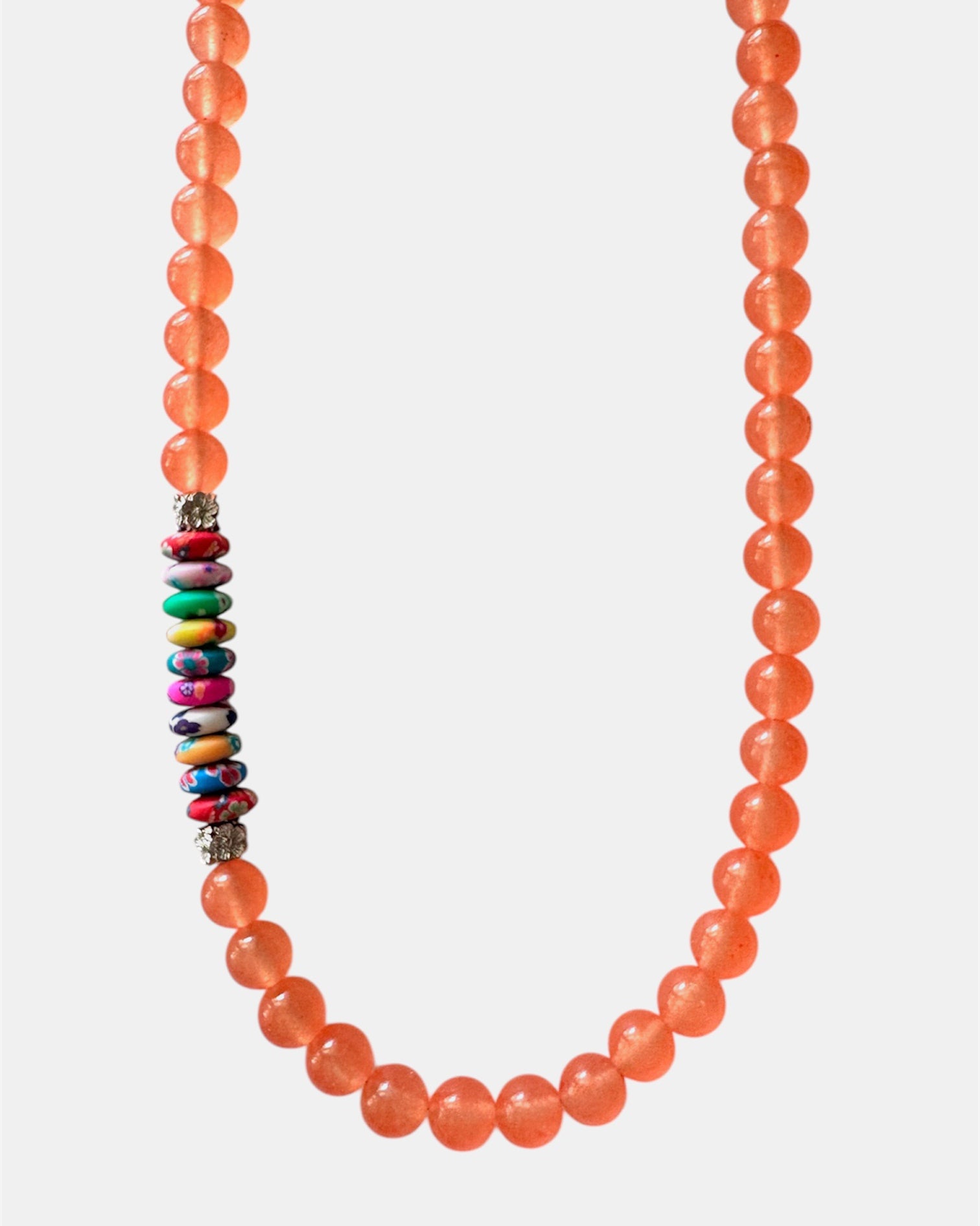 Vibrant orange necklace with beads and multicolor elements, handmade statement jewelry with a playful and colorful design