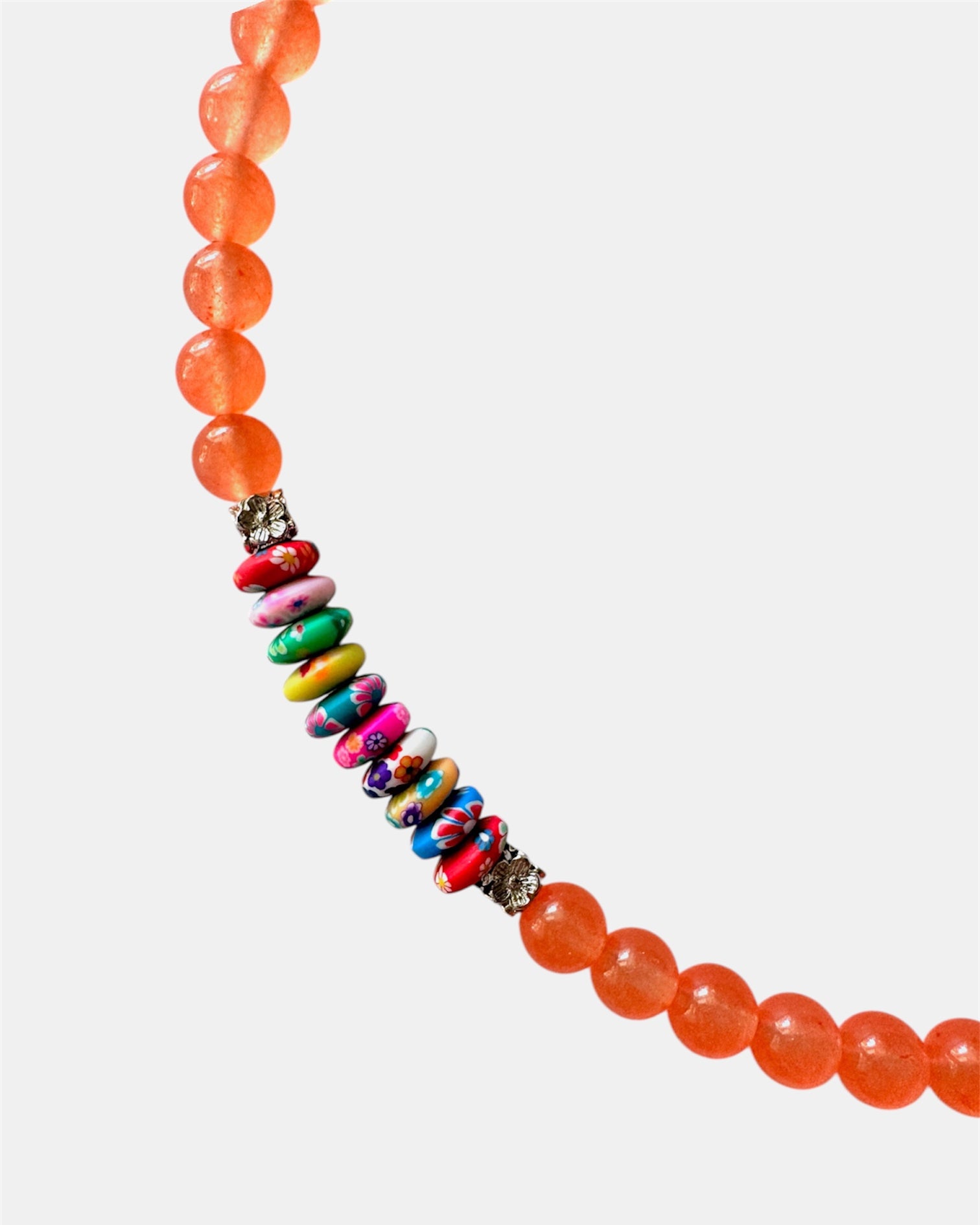 Vibrant orange necklace with beads and multicolor elements, handmade statement jewelry with a playful and colorful design