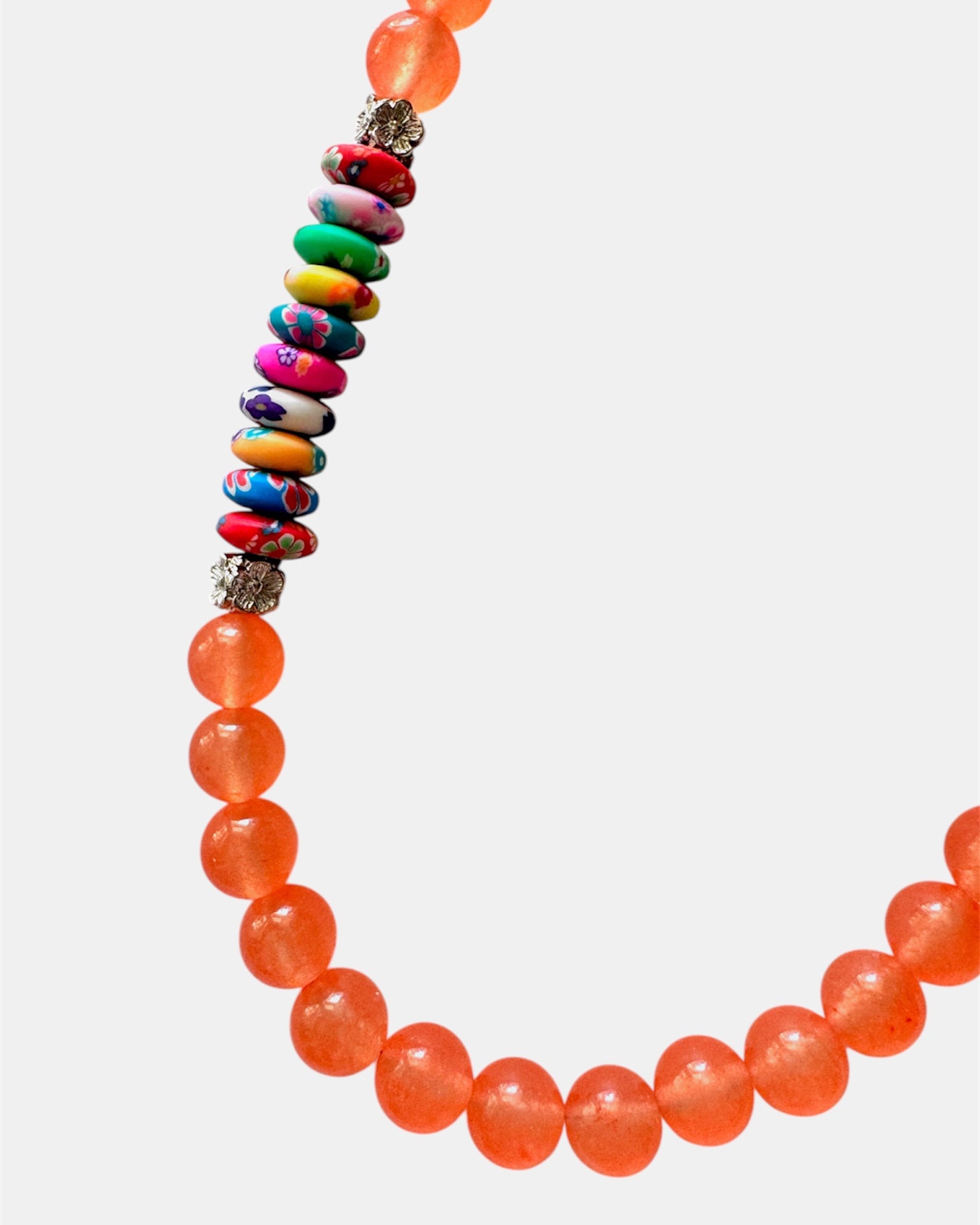 Vibrant orange necklace with beads and multicolor elements, handmade statement jewelry with a playful and colorful design