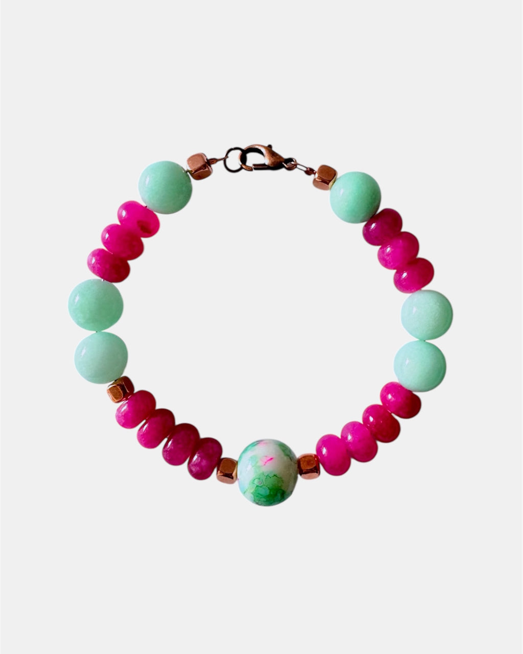 Pink and mint beaded bracelet featuring a ceramic charm for a playful and colorful style