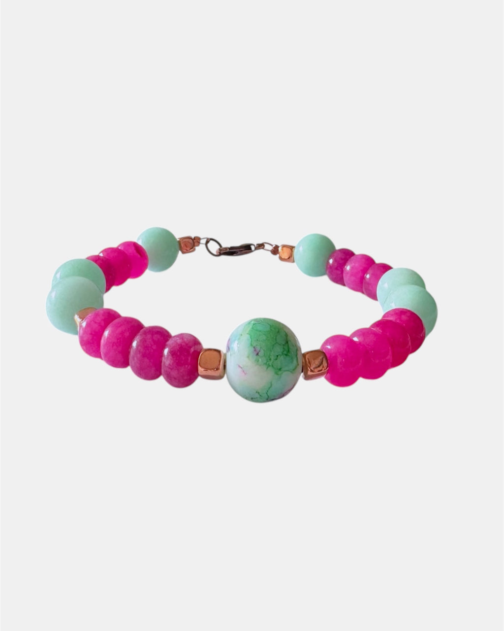 Pink and mint beaded bracelet featuring a ceramic charm for a playful and colorful style