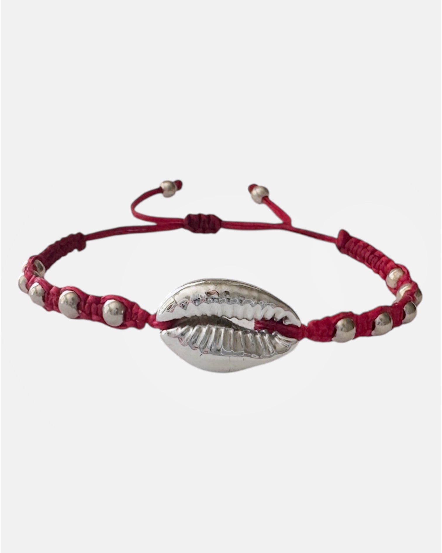 Pink macrame bracelet with silver shell charm