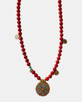 Red beaded necklace featuring a decorative motif charm for a bold and stylish accessory