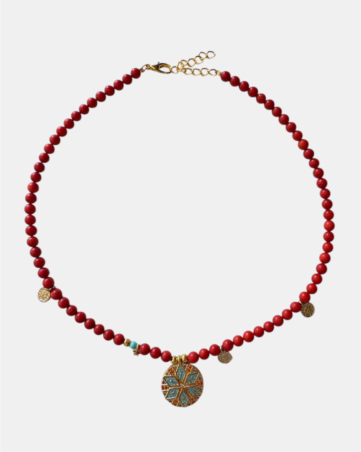 Red beaded necklace featuring a decorative motif charm for a bold and stylish accessory