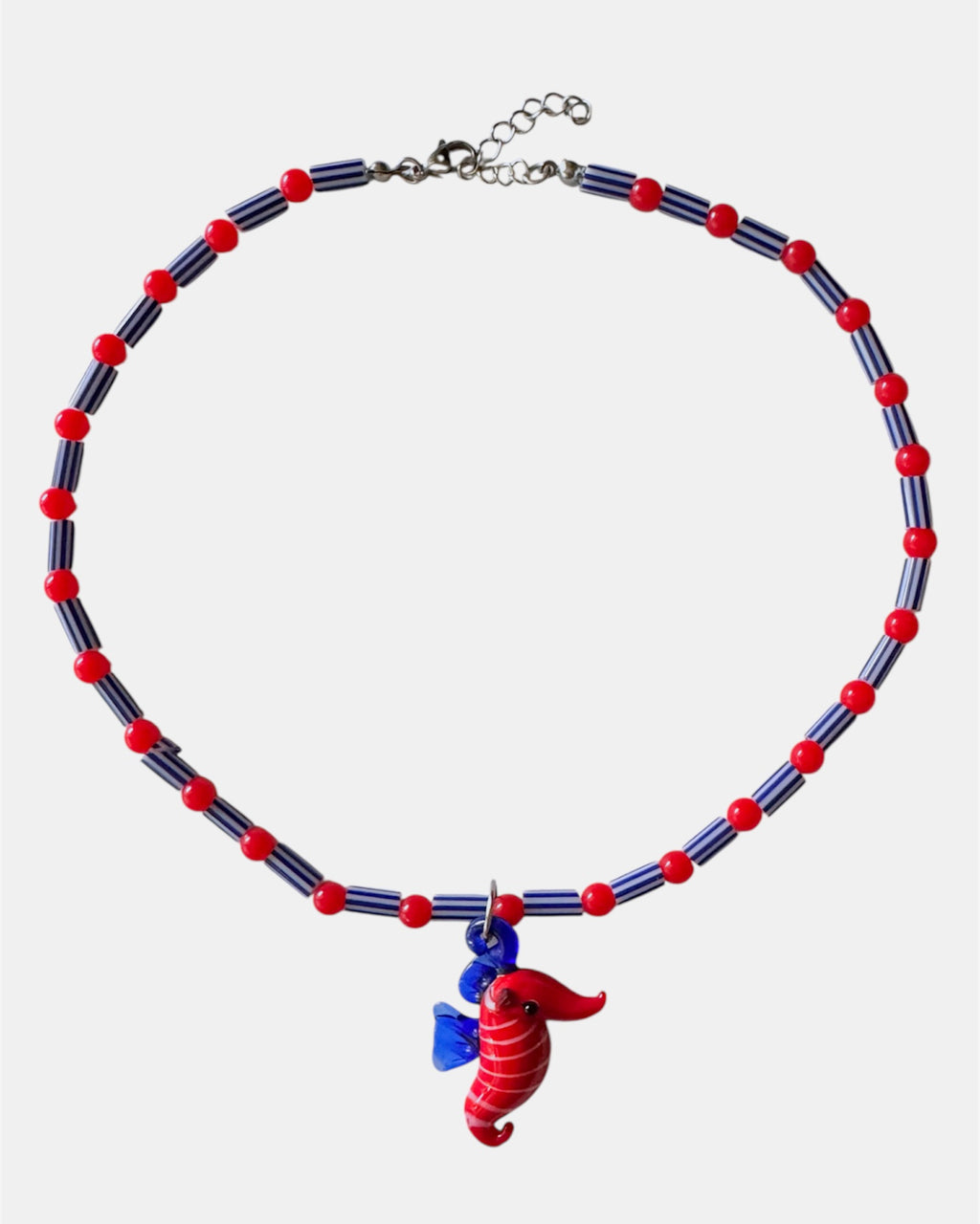 red and blue necklace with glass beads and seahorse charm, handmade jewelry piece for women and girls