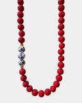 Bold red necklace with lava beads and porcelain elements, unique handmade jewelry with natural textures and modern design