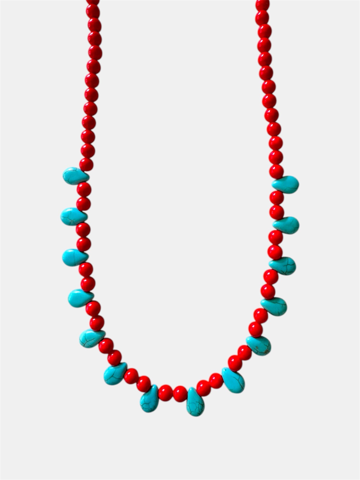 Red necklace featuring turquoise teardrop-shaped pendants for a vibrant and stylish look