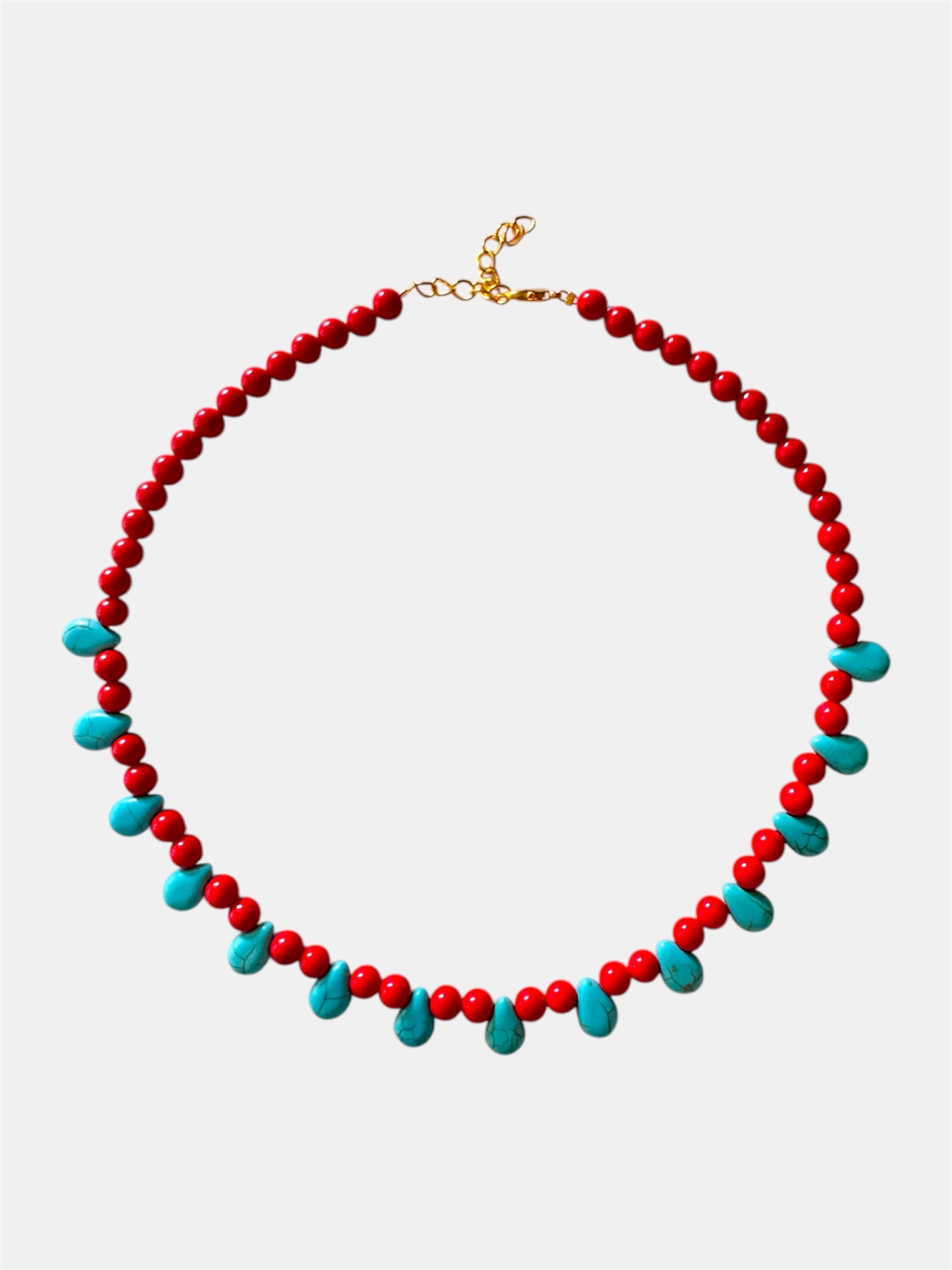 Red necklace featuring turquoise teardrop-shaped pendants for a vibrant and stylish look