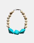 Elegant silver bracelet with ecru beads and turquoise stones, stylish handmade jewelry for everyday wear or special occasions