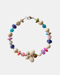 Silver bracelet with ecru and multicolored beads featuring a butterfly charm