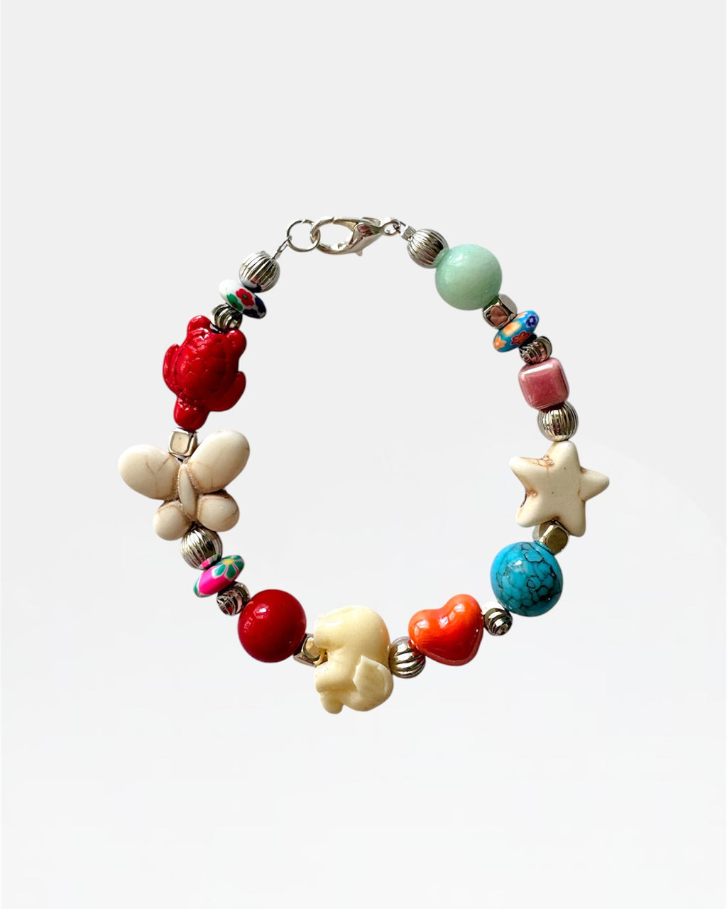 Silver bracelet with multicolored beads and patterns.