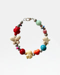 Silver bracelet with multicolored beads and patterns.