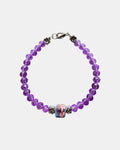 Stylish silver bracelet with purple crystal beads and a ceramic bead, elegant handmade jewelry piece for modern and chic looks