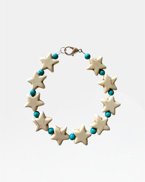 Silver bracelet with stars and turquoise beads.