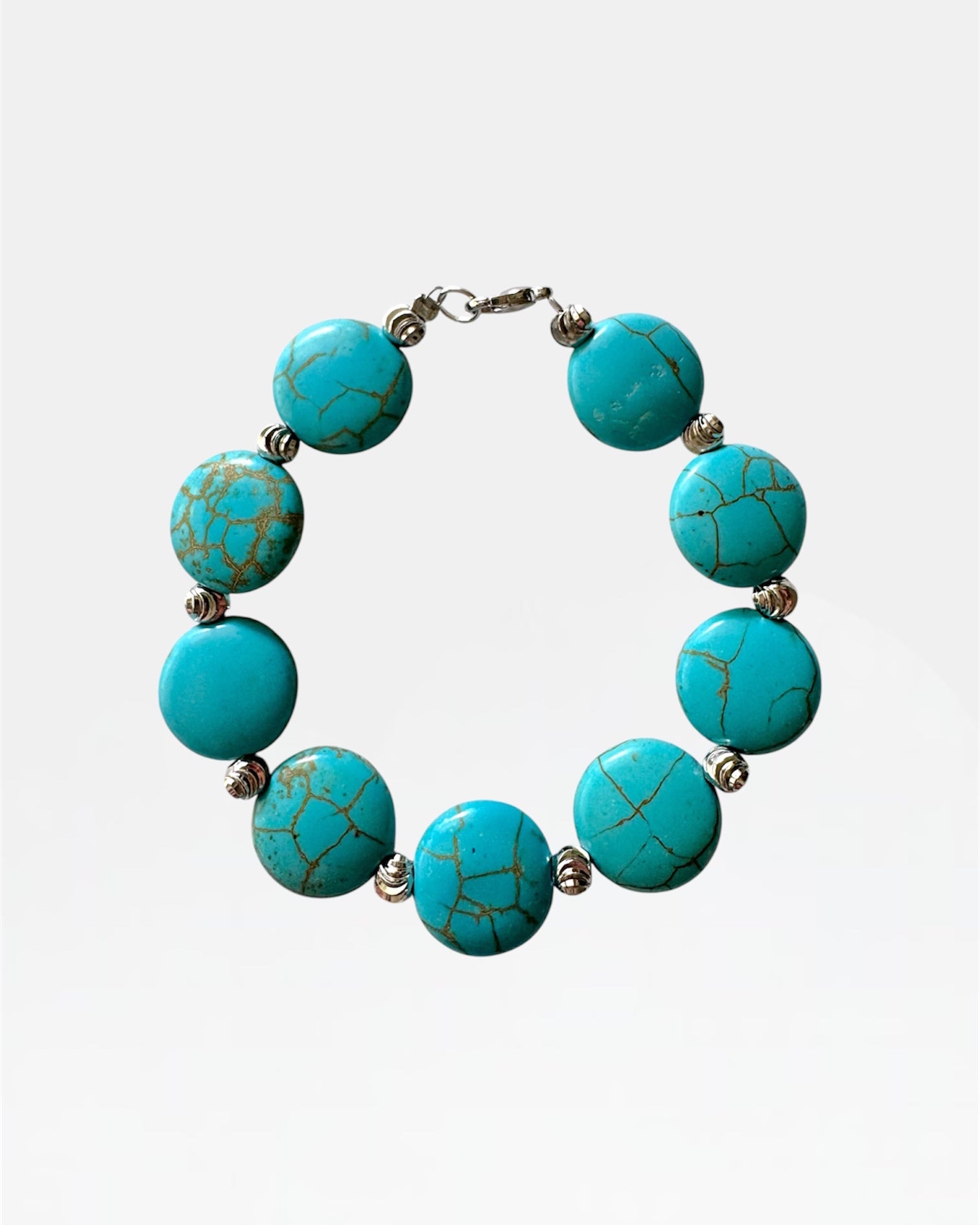 Silver bracelet with turquoise beads.