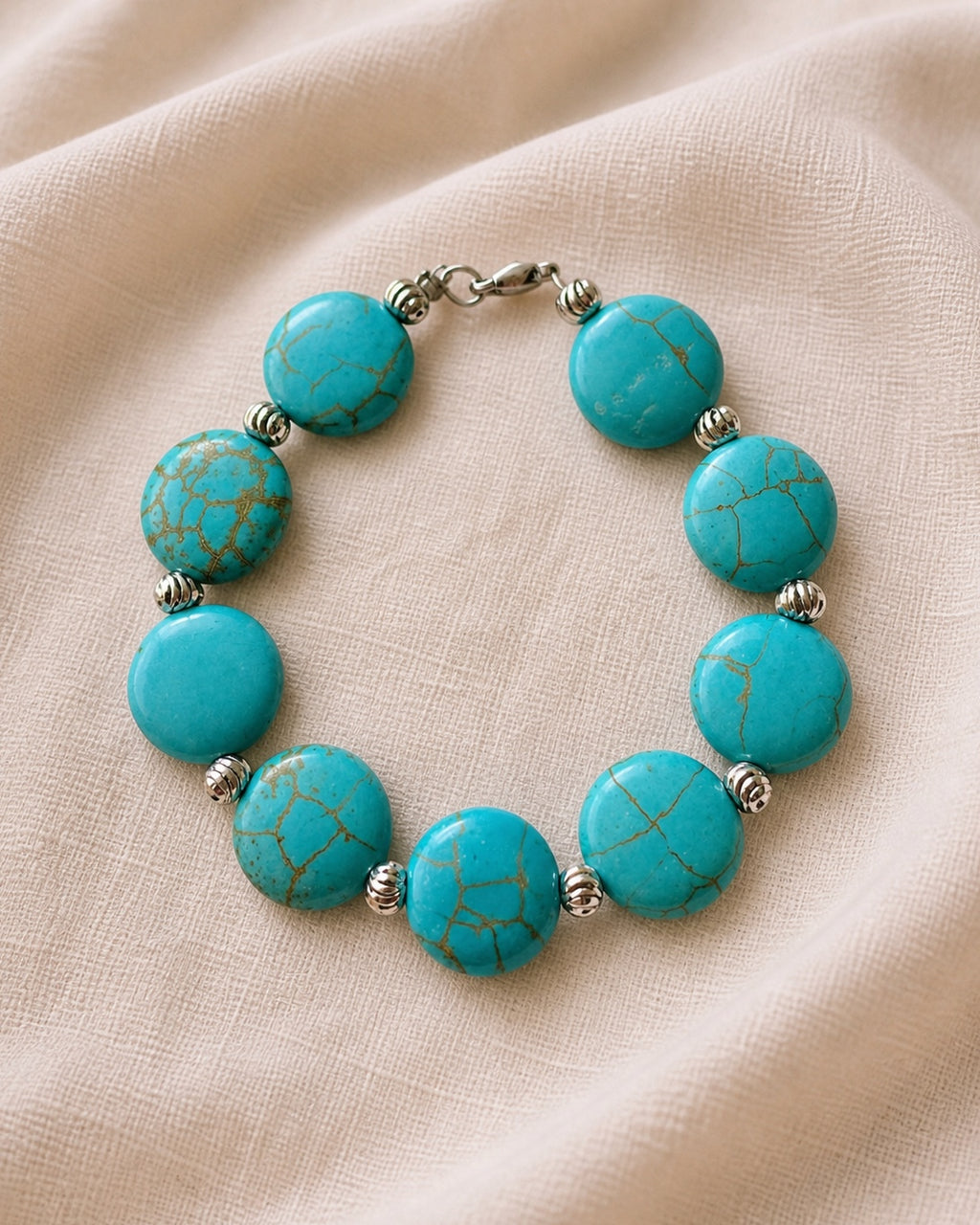 Silver bracelet with turquoise beads.