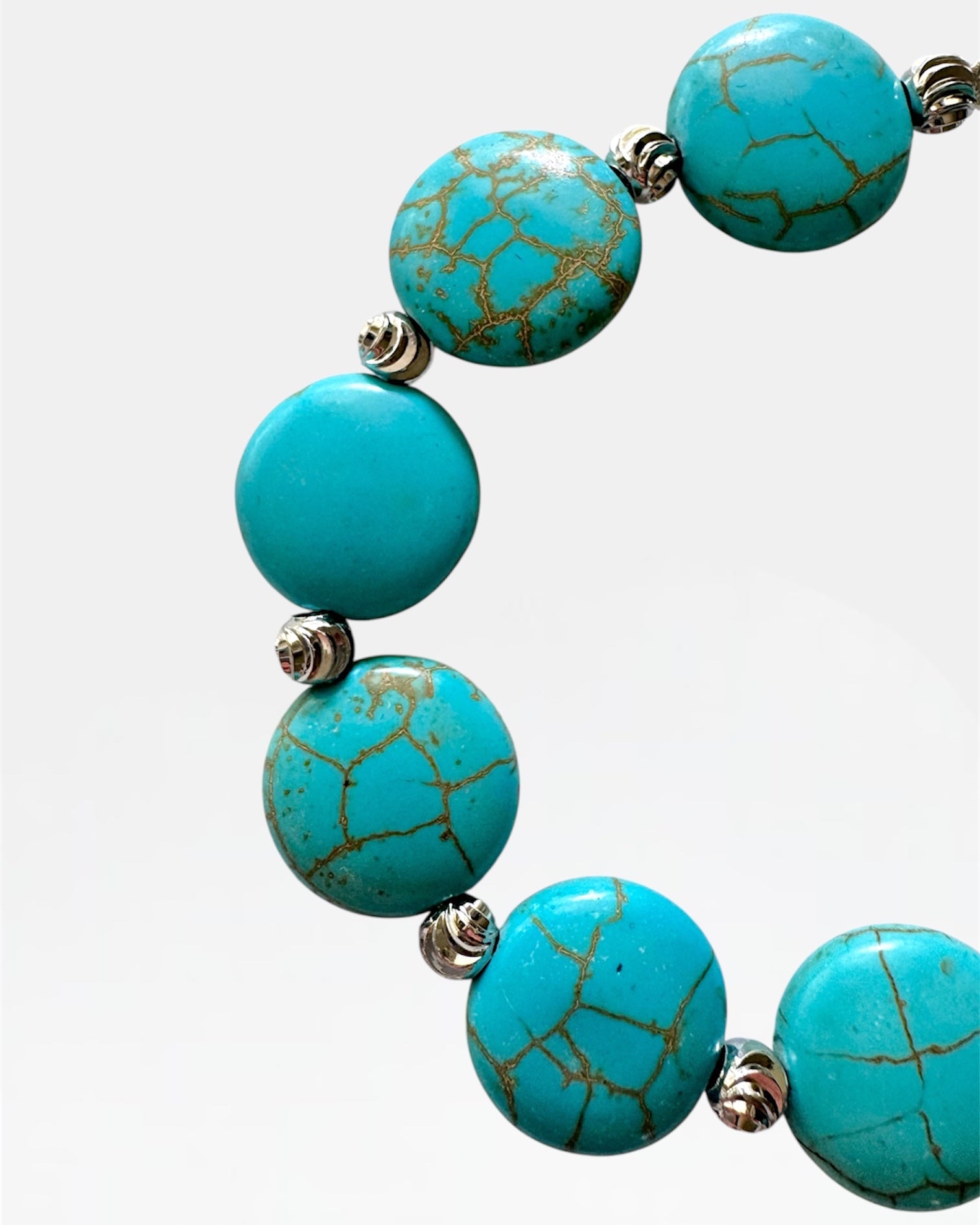 Silver bracelet with turquoise beads.