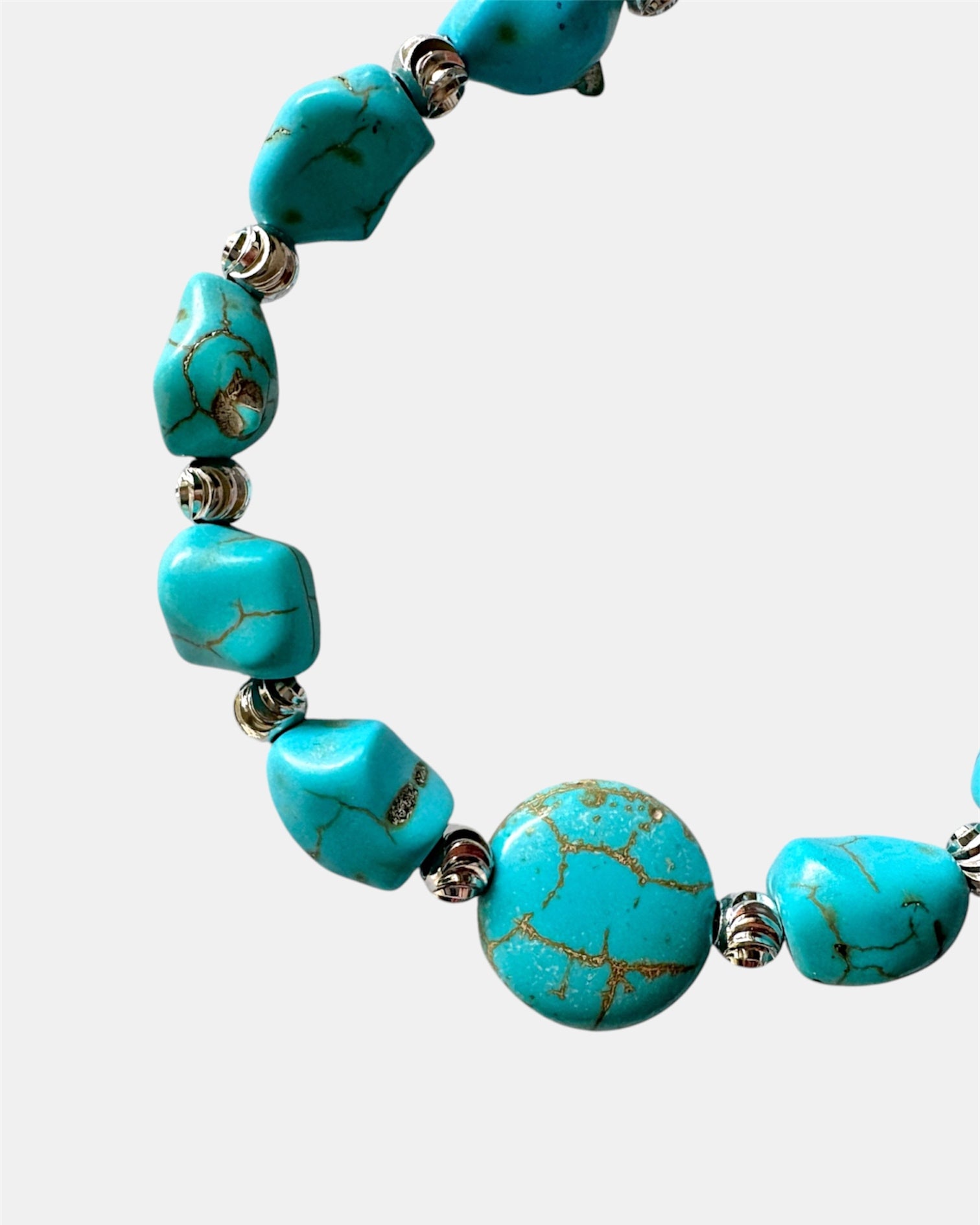 Silver bracelet with turquoise beads.