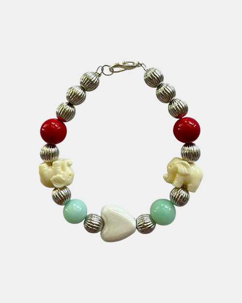 Silver bracelet with elephant charms and heart detail in elegant symbolic style