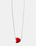 Silver chain necklace with a red heart charm