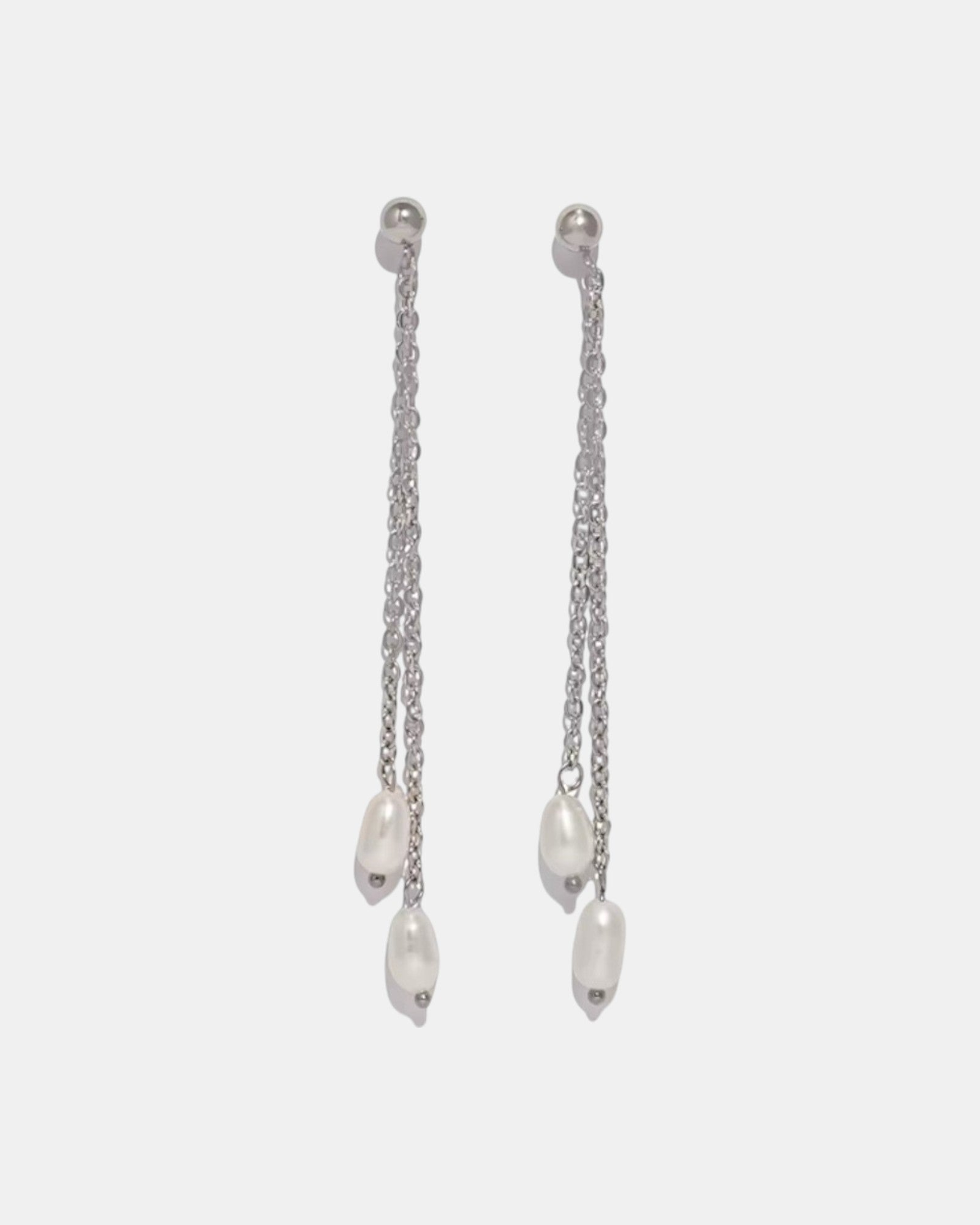 Silver dangle earrings with a pearl charm