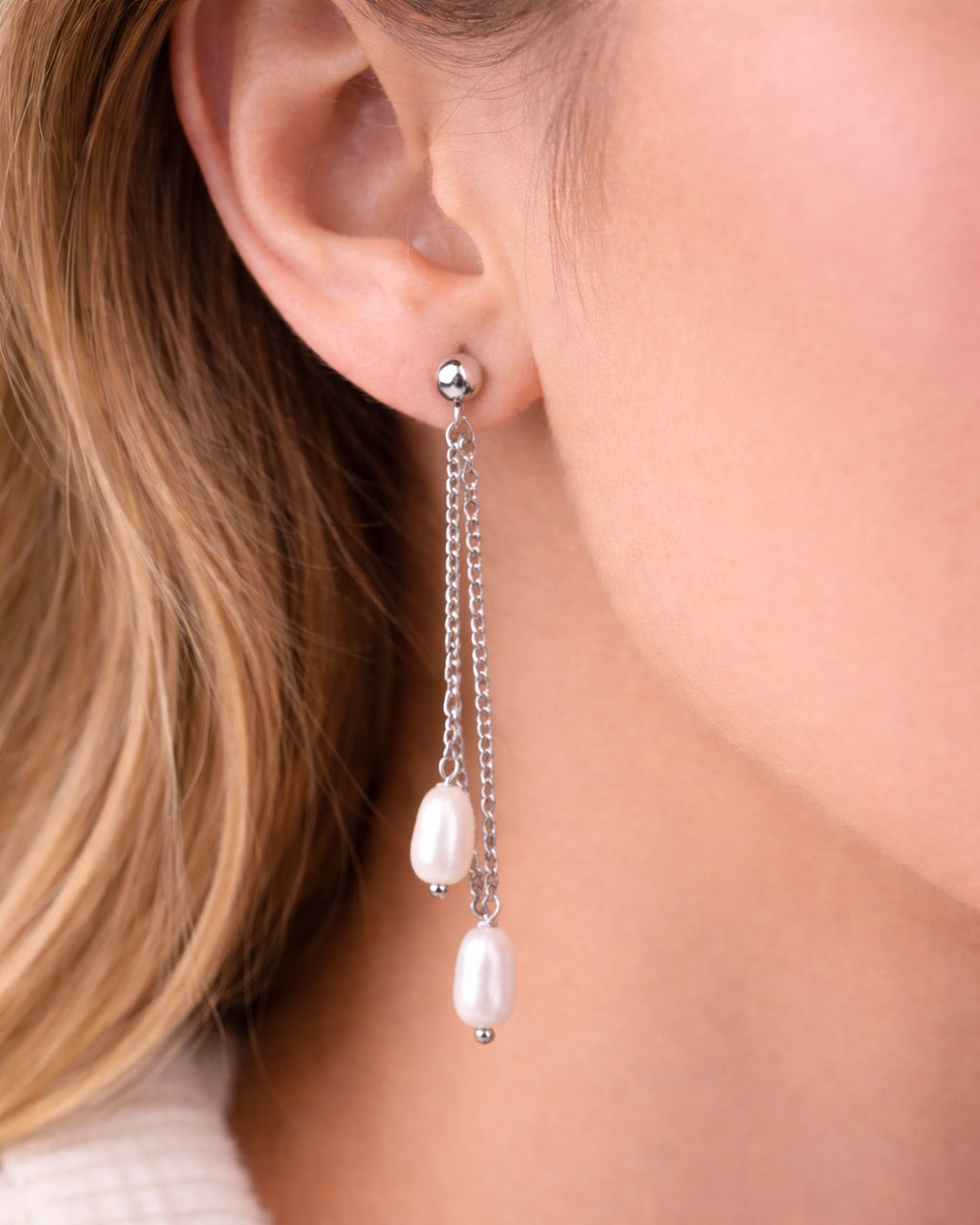 Silver dangle earrings with a pearl charm