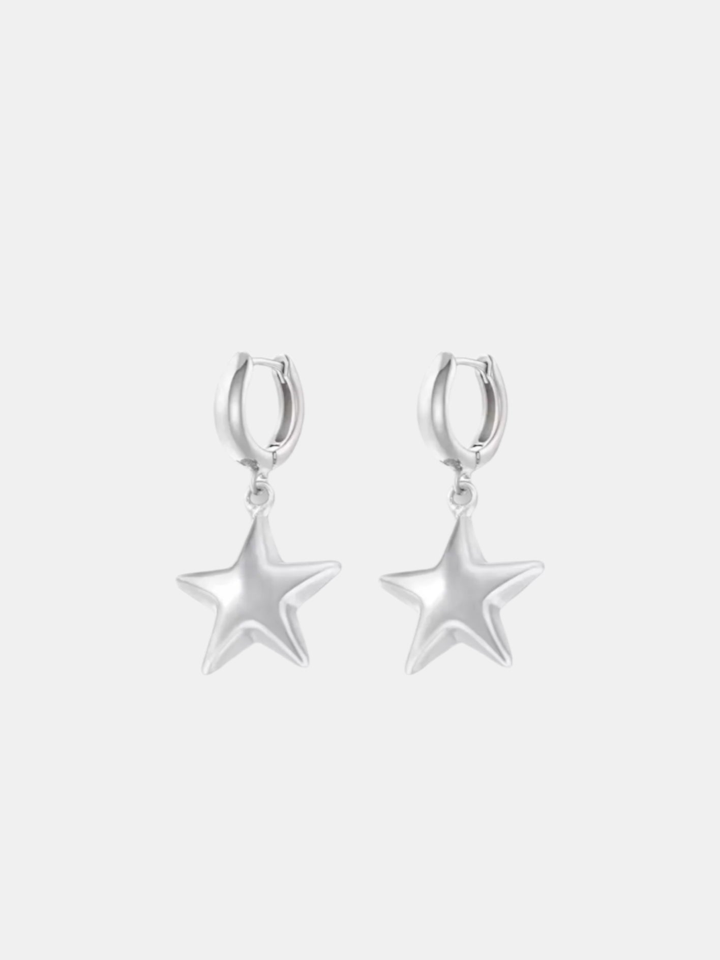 Silver dangle earrings with a star design