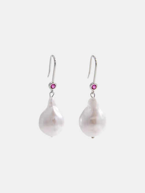Silver dangling earrings.