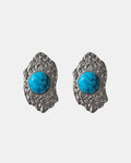 Silver dangling earrings with teal stone.