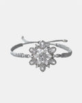 silver macrame bracelet with flower charm