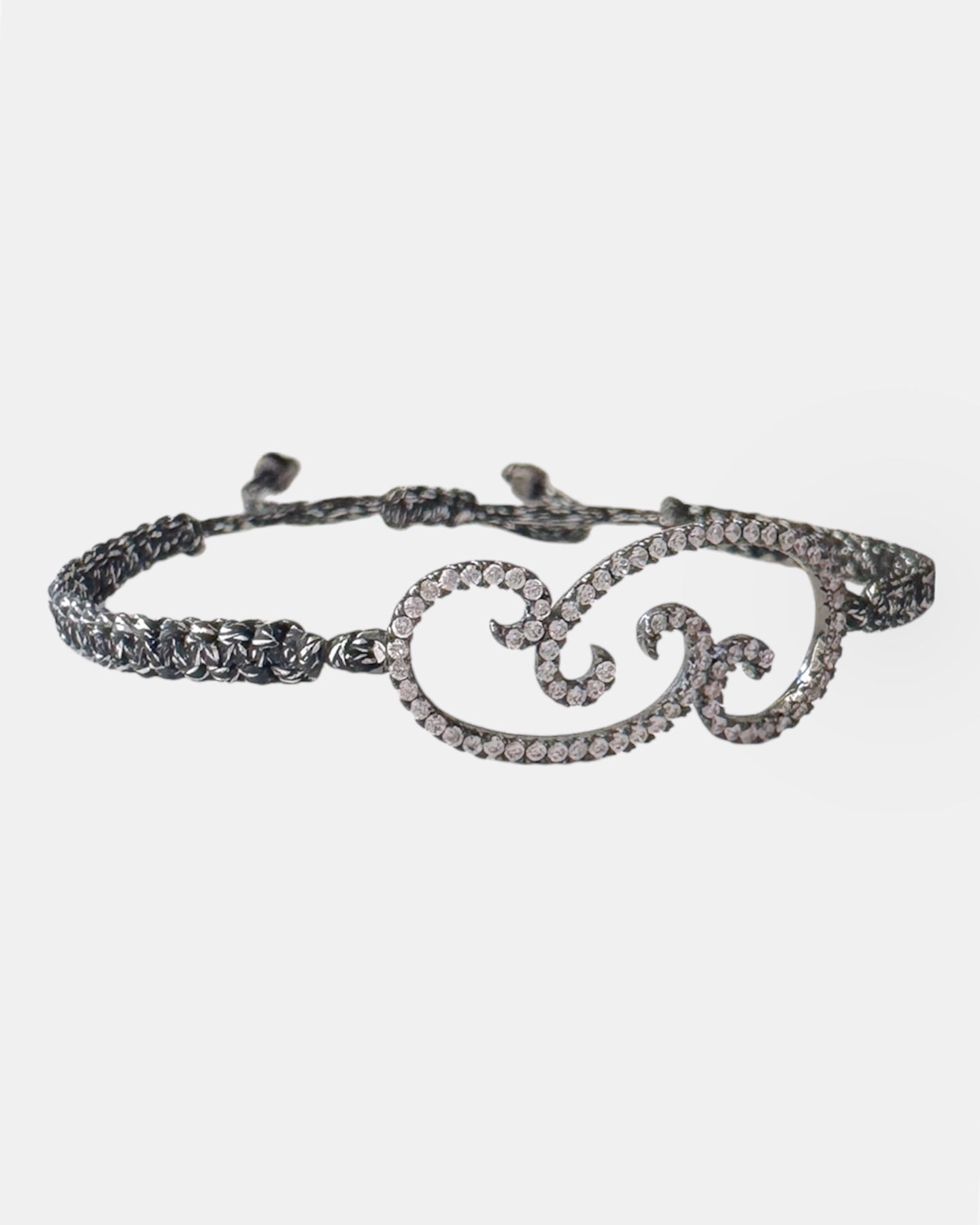 Silver macrame bracelet with flower charm